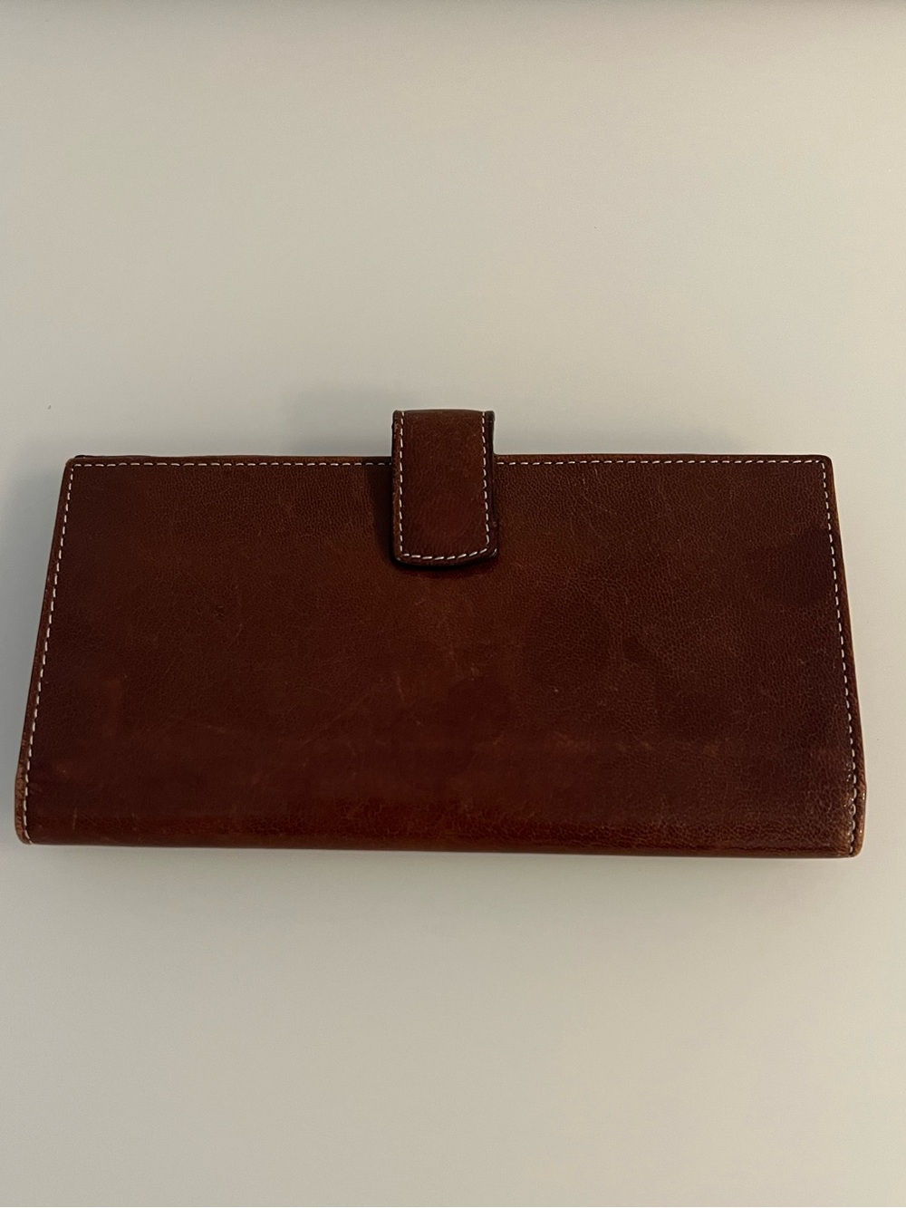 Tusk brown leather slim wallet with red interior. Brand new, without tags.